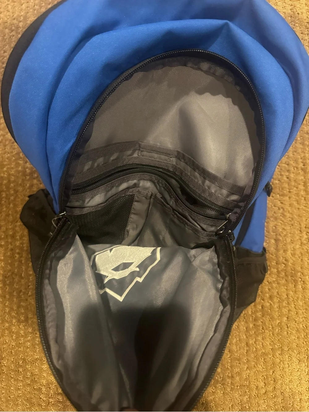 The North Face Blue and Black Backpack with Front Logo Connector
